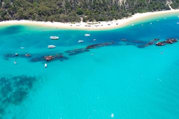 An aerial view of ship wrecks at Tangalooma from above